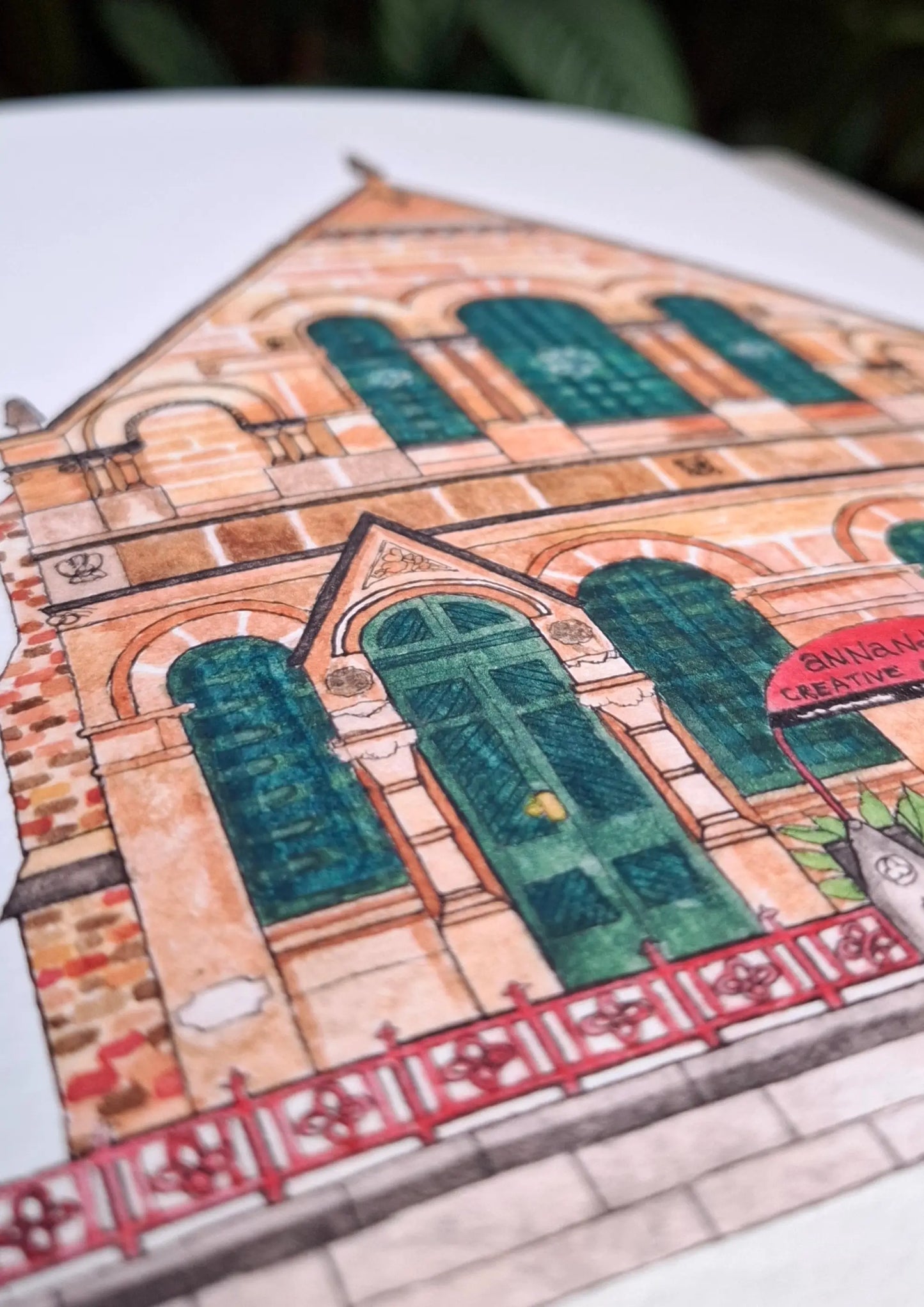 Close up of the print of ACAC illustration showing close up detail of left side green stained glass windows and doors.